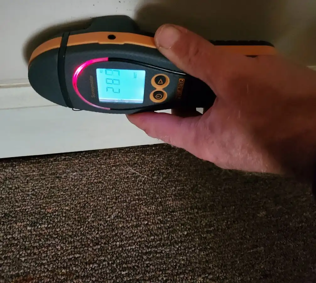 Moisture detection at baseboard during Burst Pipe Cleanup in Merrimac